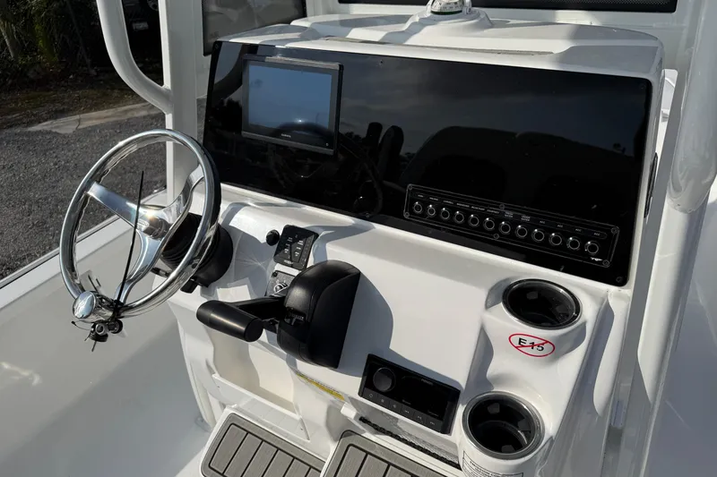 Slide: The Image of 2026 Tidewater 2110 Bay Max boat console with steering wheel and control panel. - 31