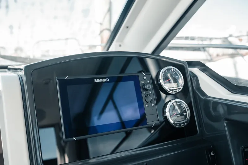 Slide: The Image of Dashboard of 2026 Bayliner Trophy T23 Explorer with Simrad display and gauges. - 10