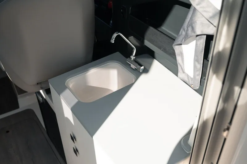 Slide: The Image of Interior sink of 2026 Bayliner Trophy T23 Explorer boat, featuring modern design. - 11