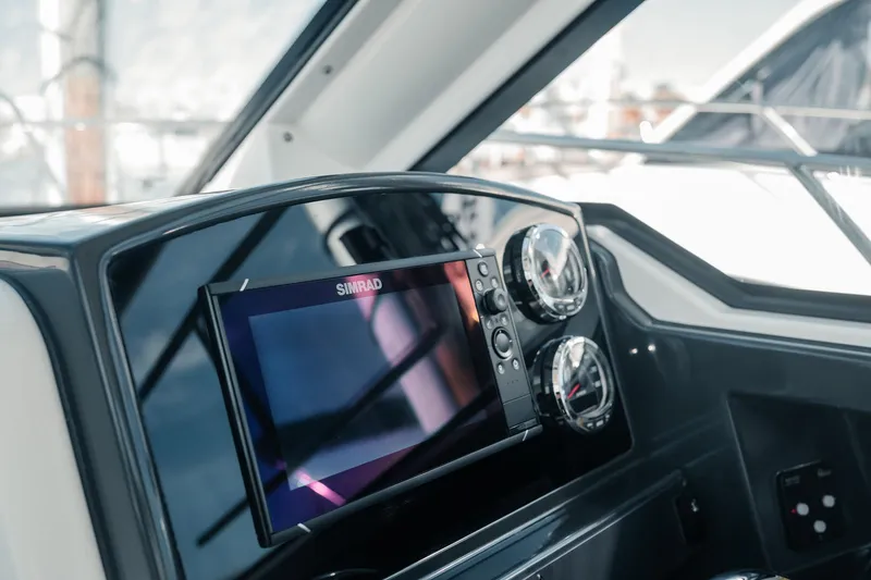 Slide: The Image of Dashboard of 2026 Bayliner Trophy T23 Explorer with Simrad navigation system. - 9
