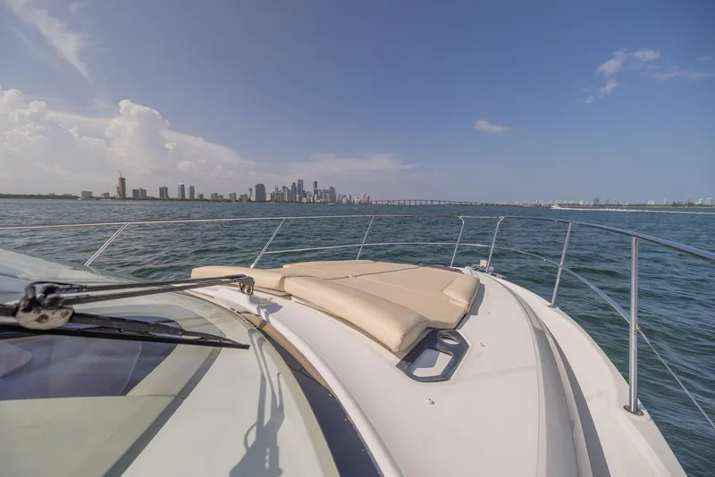 Slide: The Image of 2013 Beneteau Gran Turismo 38 yacht cruising with city skyline in background. - 18