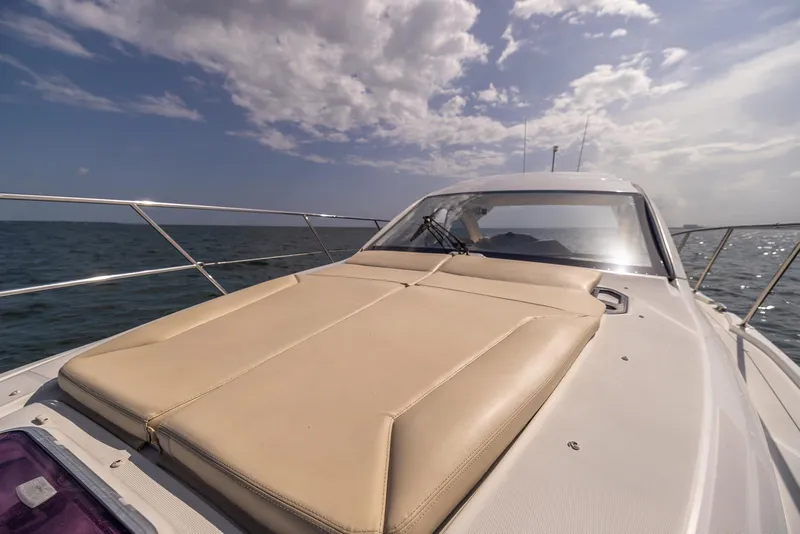 Slide: The Image of 2013 Beneteau GRAN TURISMO 38 yacht on open water under a partly cloudy sky. - 19