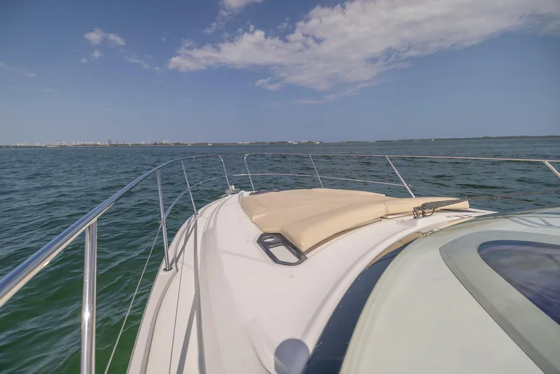 Slide: The Image of 2013 Beneteau Gran Turismo 38 yacht cruising on open water under a clear blue sky. - 20