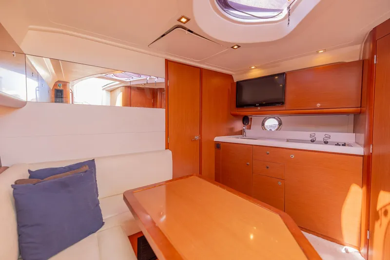 Slide: The Image of Luxurious interior of 2013 Beneteau Gran Turismo 38 yacht with modern kitchen and seating area. - 25