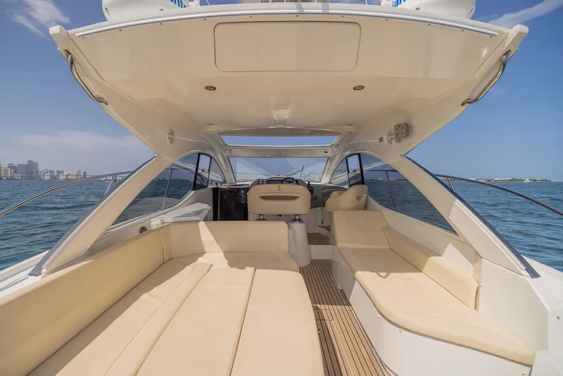 Slide: The Image of 2013 Beneteau Gran Turismo 38 yacht interior with spacious seating, open water view. - 3