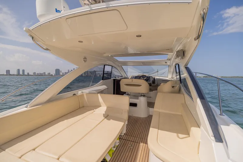 Slide: The Image of 2013 Beneteau Gran Turismo 38 yacht interior with spacious seating and ocean view. - 4