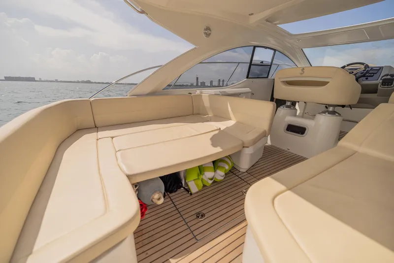 Slide: The Image of Interior of 2013 Beneteau Gran Turismo 38 yacht with beige seating and ocean view. - 5