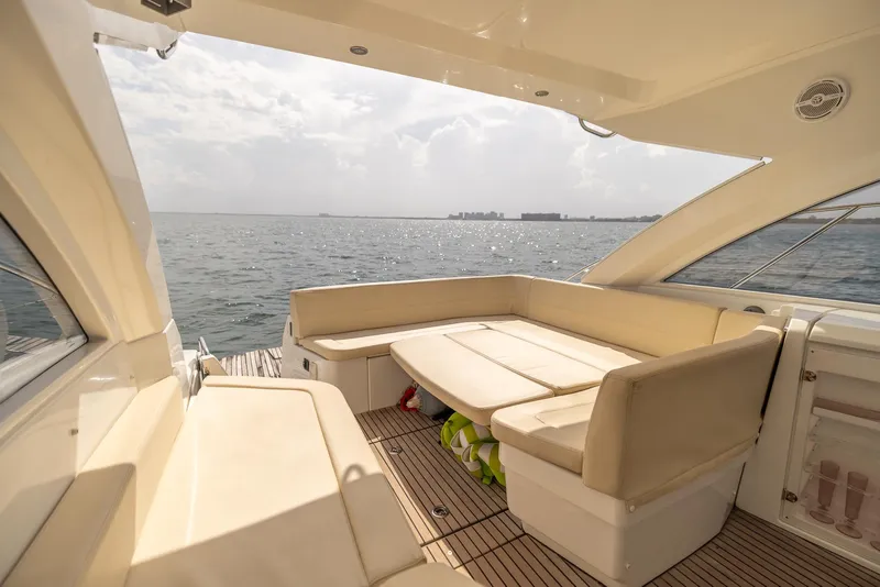 Slide: The Image of Beneteau Gran Turismo 38 yacht interior, 2013 model, featuring spacious seating and ocean view. - 9