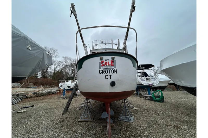 Slide: The Image of 1973 Willard 30 boat for sale in Groton, CT, displayed on stands. - 17