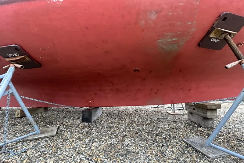 Slide: The Image of Bottom view of a 1973 Willard 30 boat hull on stands. - 22