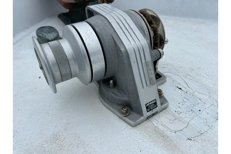 Slide: The Image of 1973 Willard 30 boat winch on deck, showing wear and rust. - 29