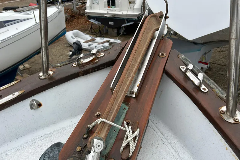 Slide: The Image of Close-up of a 1973 Willard 30 sailboat deck with metal fittings and ropes. - 31