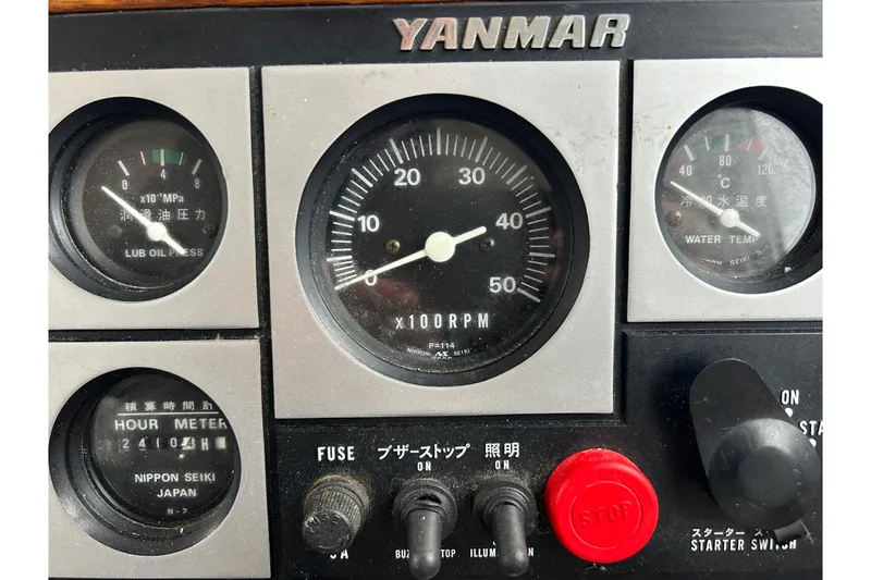 Slide: The Image of Control panel of a 1973 Willard 30 with Yanmar engine gauges and switches. - 56