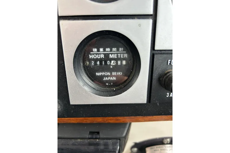 Slide: The Image of Hour meter on 1973 Willard 30, showing 2410.4 hours, Nippon Seiki Japan. - 57