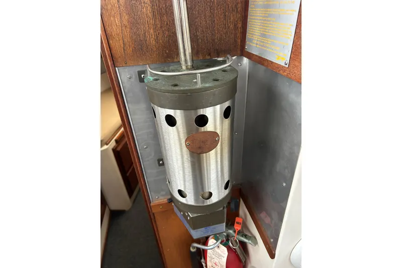 Slide: The Image of 1973 Willard 30 interior with metal cylindrical component and fire extinguisher. - 58