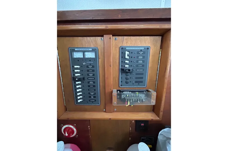 Slide: The Image of Electrical panel of a 1973 Willard 30 boat with switches and meters. - 61