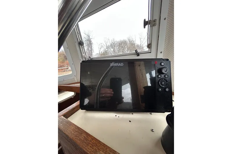 Slide: The Image of Simrad navigation system inside a 1973 Willard 30 boat cabin. - 62