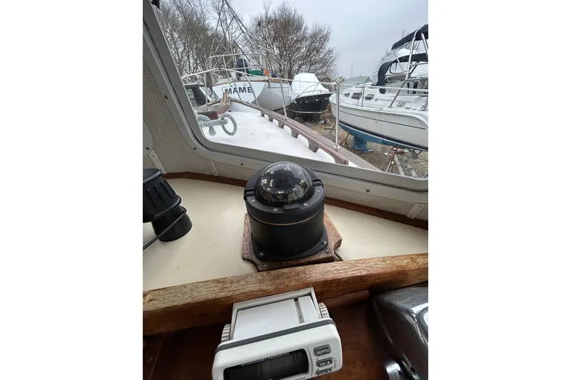 Slide: The Image of Interior view of a 1973 Willard 30 boat with compass and navigation equipment. - 63