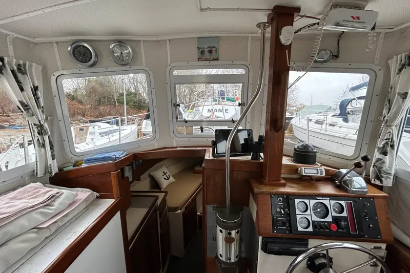 Slide: The Image of Interior of a 1973 Willard 30 boat with navigation equipment and cozy seating. - 65