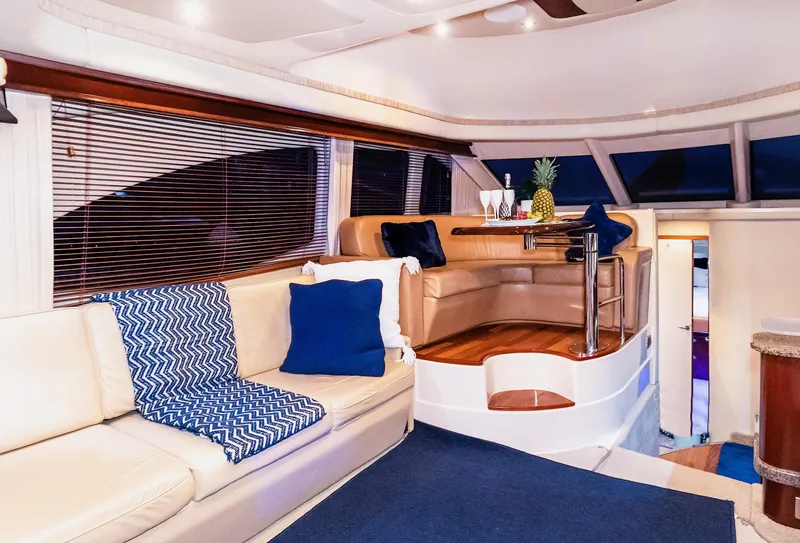 Slide: The Image of Luxurious interior of 2006 Sea Ray 44 Sedan Bridge yacht with elegant seating and decor. - 18