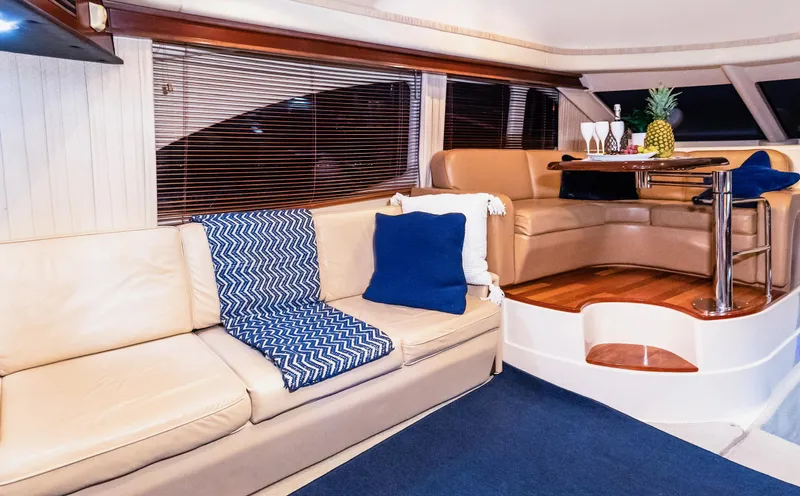 Slide: The Image of Luxurious interior of 2006 Sea Ray 44 Sedan Bridge yacht with elegant seating and decor. - 21