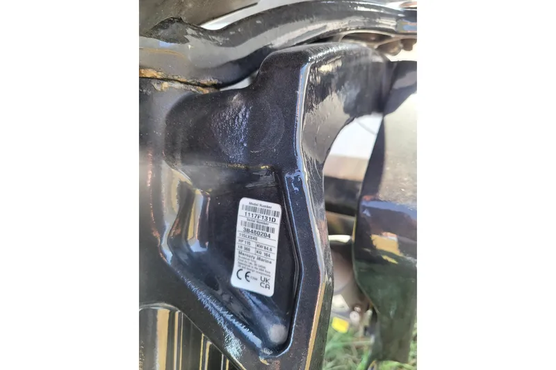 Slide: The Image of Close-up of a 2024 Triton 179 TrX boat component with a visible label. - 2