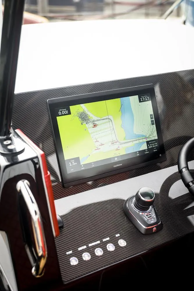 Slide: The Image of Dashboard of 2023 Revolt Comfort 47 with navigation display and controls. - 10