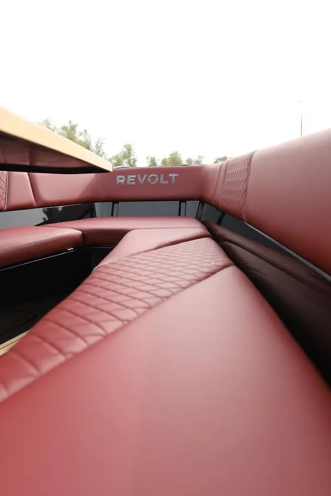 Slide: The Image of Luxurious red seating in 2023 Revolt Comfort 47 boat interior. - 18