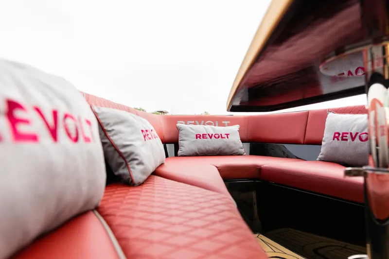 Slide: The Image of Luxurious interior of 2023 Revolt Comfort 47 boat with red seating and branded cushions. - 6