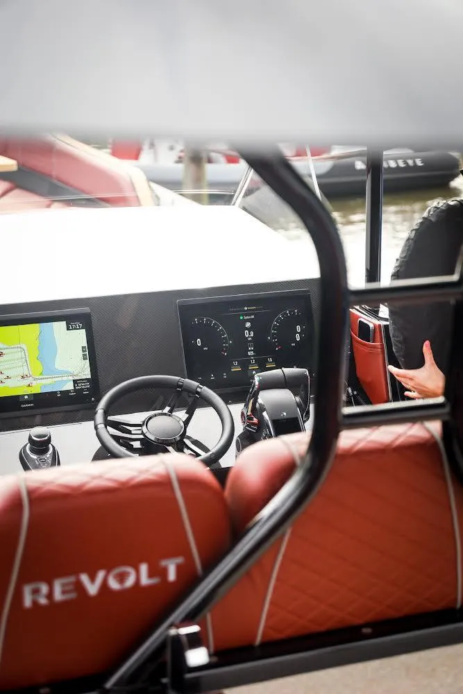 Slide: The Image of Interior view of 2023 Revolt Comfort 47 boat with modern dashboard and navigation system. - 9
