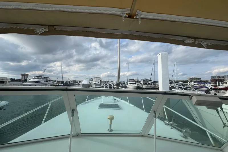 Slide: The Image of View from Mainship Pilot 30, 2000 model, overlooking marina with cloudy sky. - 23