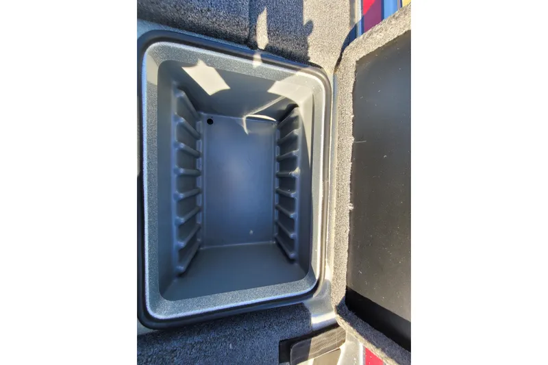Slide: The Image of Open storage compartment in 2024 Triton 179 TrX boat, featuring a spacious interior. - 13