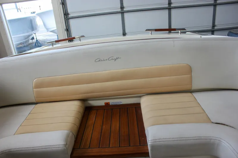 Slide: The Image of 2011 Chris-Craft Corsair 28 boat in a workshop, showcasing sleek design and polished finish. - 10
