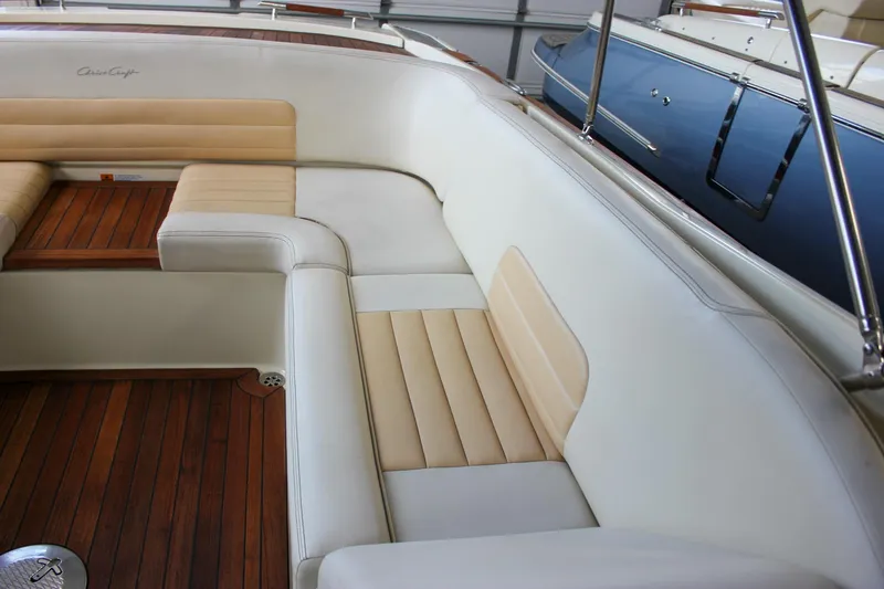 Slide: The Image of 2011 Chris-Craft Corsair 28 boat with teak deck and signature logo. - 11