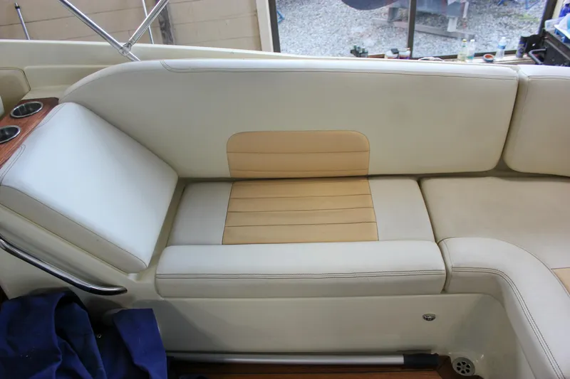 Slide: The Image of 2011 Chris-Craft Corsair 28 interior with elegant seating and wooden flooring. - 19