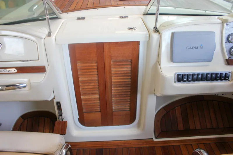 Slide: The Image of Storage compartment on a 2011 Chris-Craft Corsair 28 boat with fenders inside. - 24