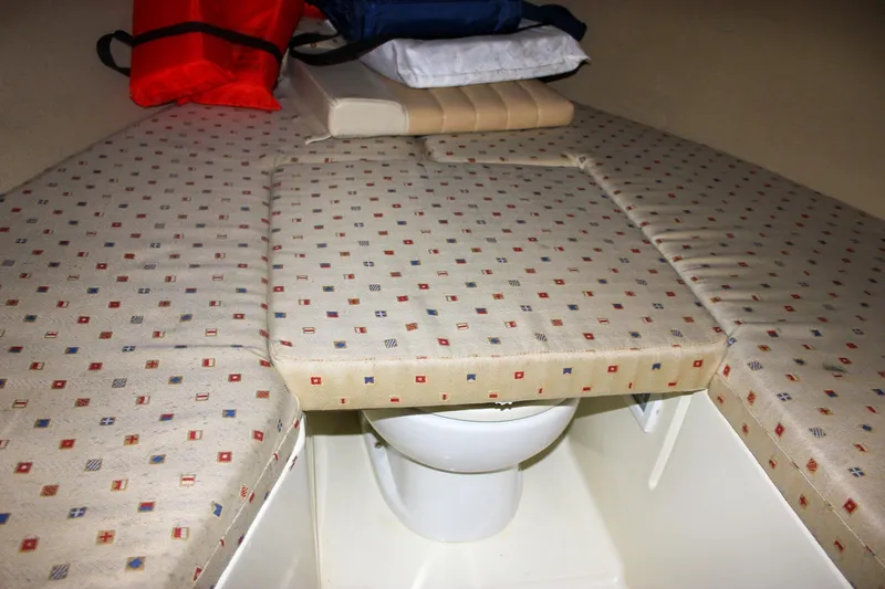 Slide: The Image of 2011 Chris-Craft Corsair 28 boat interior with beige leather seating and cup holders. - 25