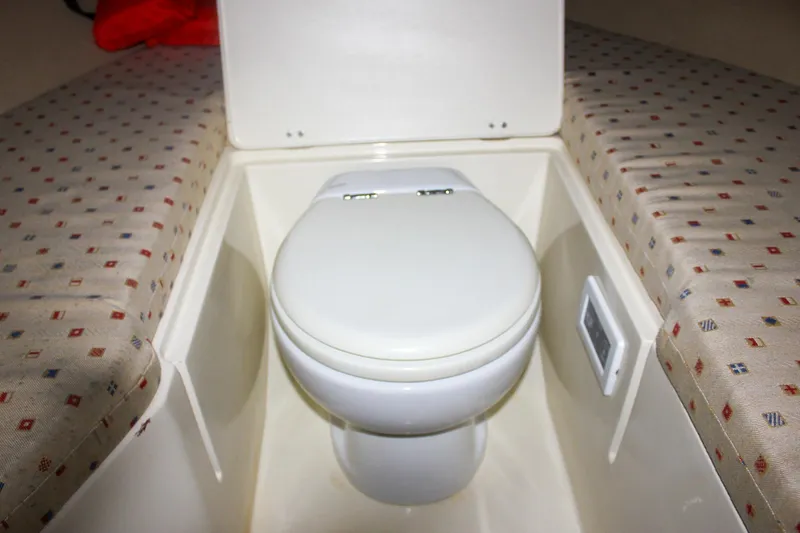 Slide: The Image of Interior of 2011 Chris-Craft Corsair 28, featuring elegant wood and chrome details. - 27