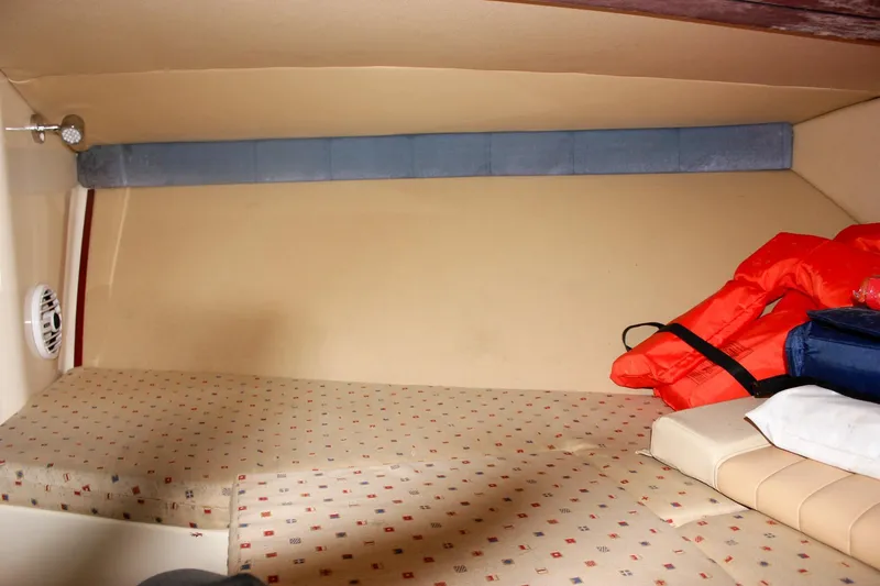 Slide: The Image of 2011 Chris-Craft Corsair 28 dashboard with storage compartment and accessories. - 28