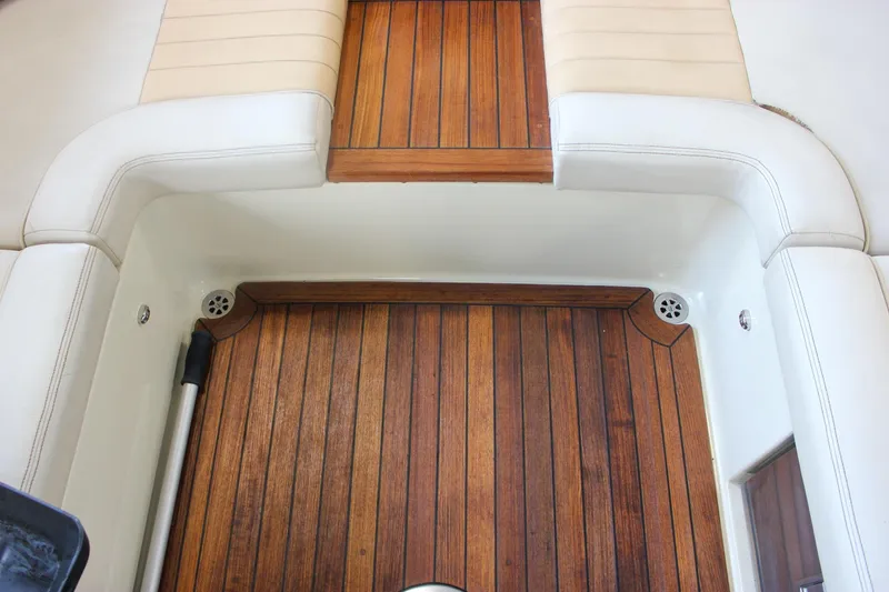 Slide: The Image of Control panel of 2011 Chris-Craft Corsair 28 boat with throttle and audio system. - 42