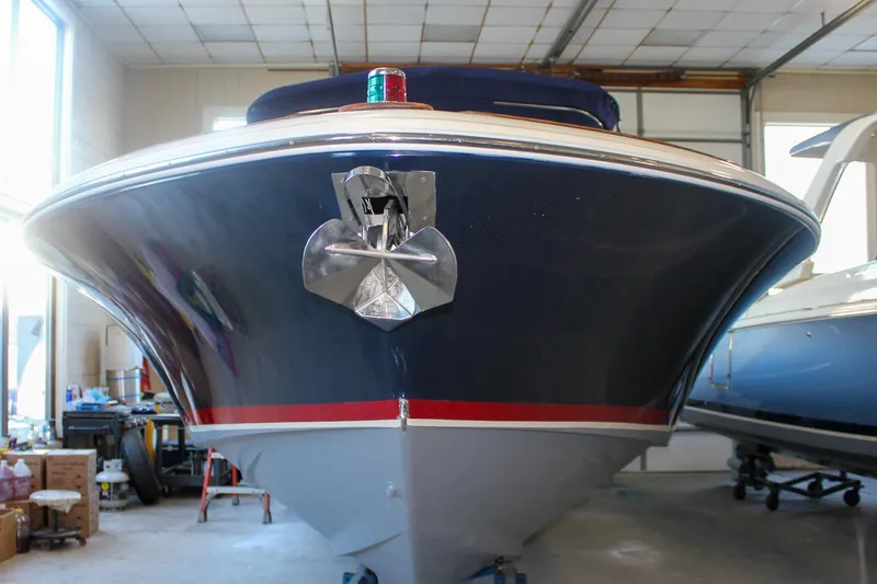 Slide: The Image of 2011 Chris-Craft Corsair 28 cockpit with leather seating and wooden steering wheel. - 45