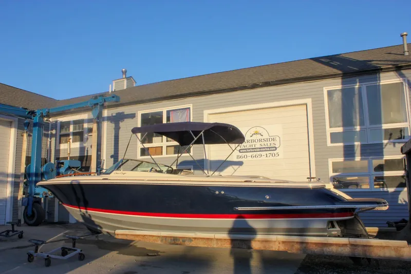 Slide: The Image of 2011 Chris-Craft Corsair 28 boat at Harborside Yacht Sales, blue hull, red stripe. - 70