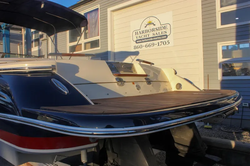 Slide: The Image of 2011 Chris-Craft Corsair 28 at Harborside Yacht Sales, rear view with wooden deck. - 71