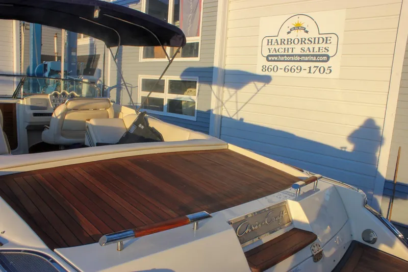 Slide: The Image of 2011 Chris-Craft Corsair 28 at Harborside Yacht Sales, featuring elegant wood deck. - 75