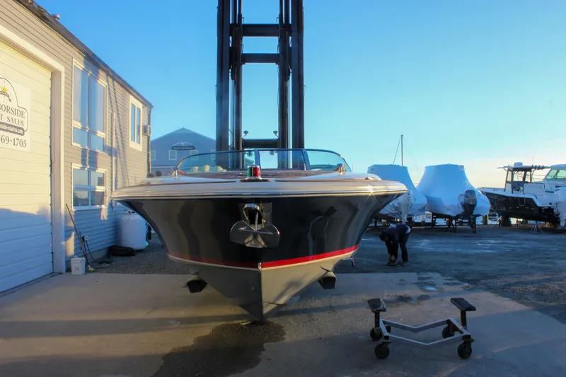 Slide: The Image of 2011 Chris-Craft Corsair 28 boat at dockside, front view, sunny day. - 77