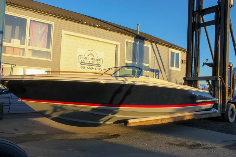 Slide: The Image of 2011 Chris-Craft Corsair 28 boat at Harborside Yacht Sales, lifted by forklift. - 83