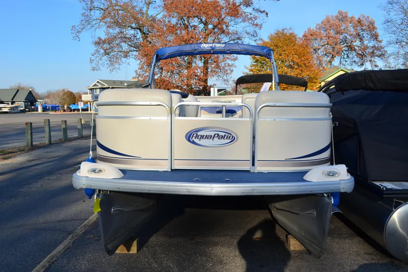 Slide: The Image of 2004 AquaPatio 22 pontoon boat parked on a sunny autumn day. - 3