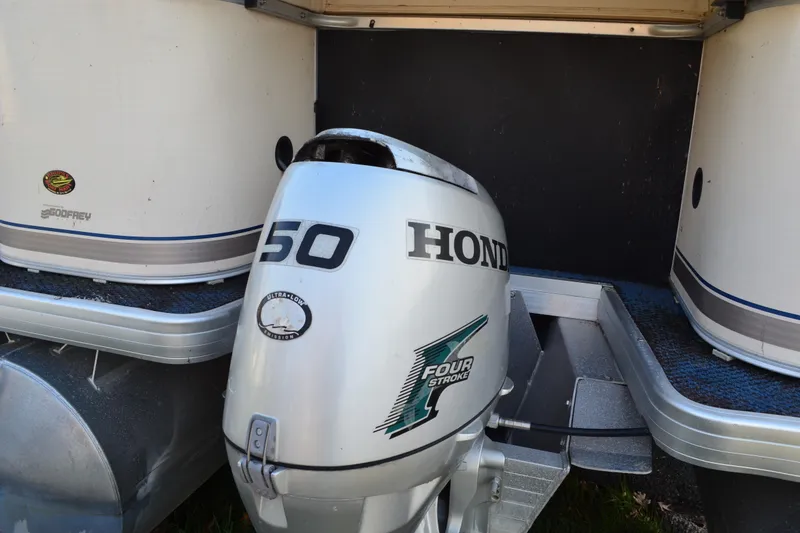 Slide: The Image of 2004 AquaPatio 22 boat with Honda 50 four-stroke outboard motor. - 5