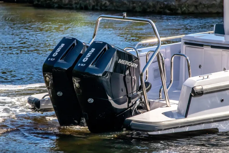 Slide: The Image of 2024 Axopar 37 Sun Top with dual Mercury 350 V10 engines on water. - 8