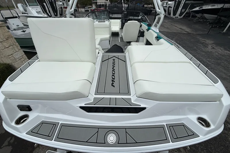 Slide: The Image of 2026 Moomba Max boat with white seating and sleek design. - 10